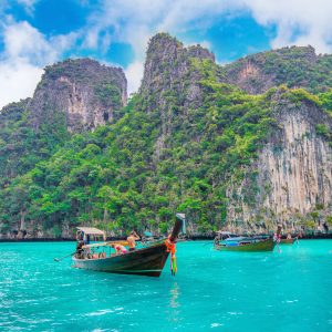 Long boat and blue water at Maya bay in Phi Phi Island, Krabi Thailand.